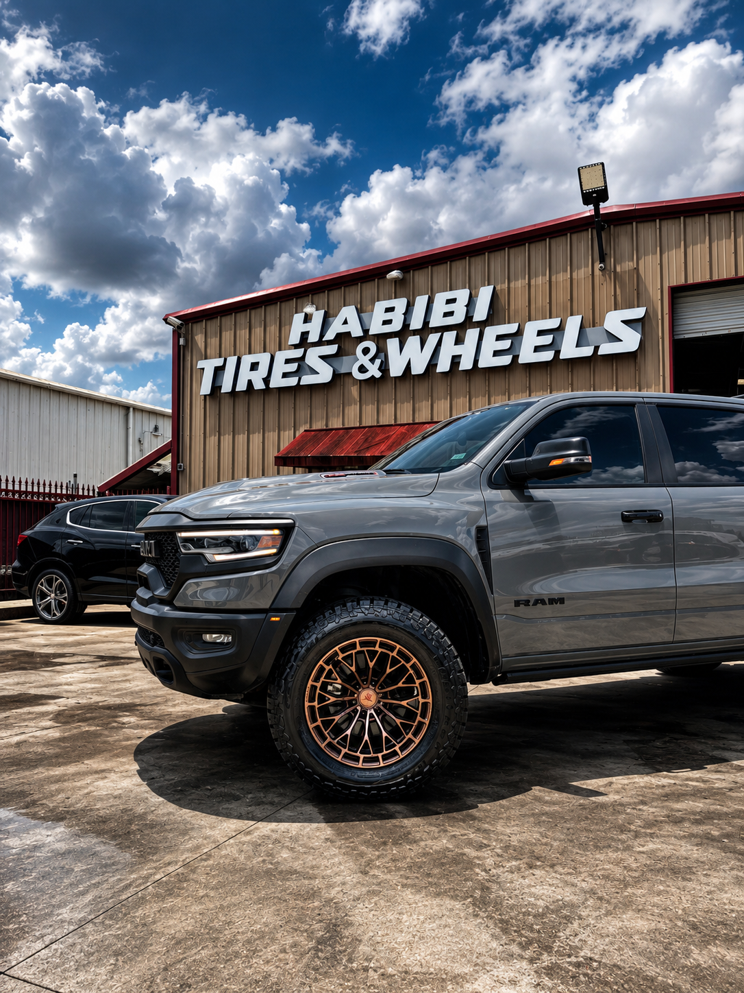 Customized RAM truck outside Habibi Tires & Wheels