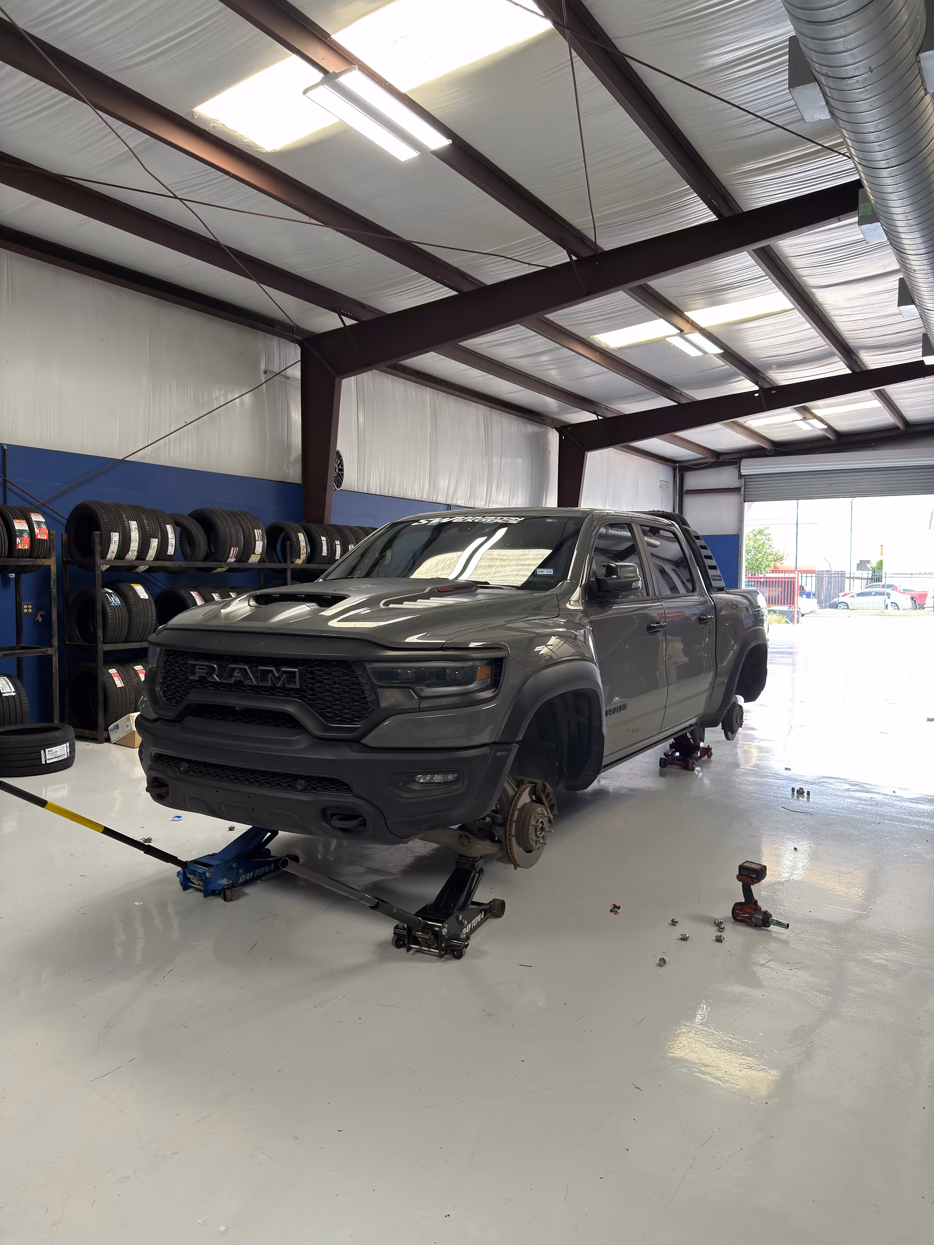RAM truck in the Habibi service bay before wheel and tire installation